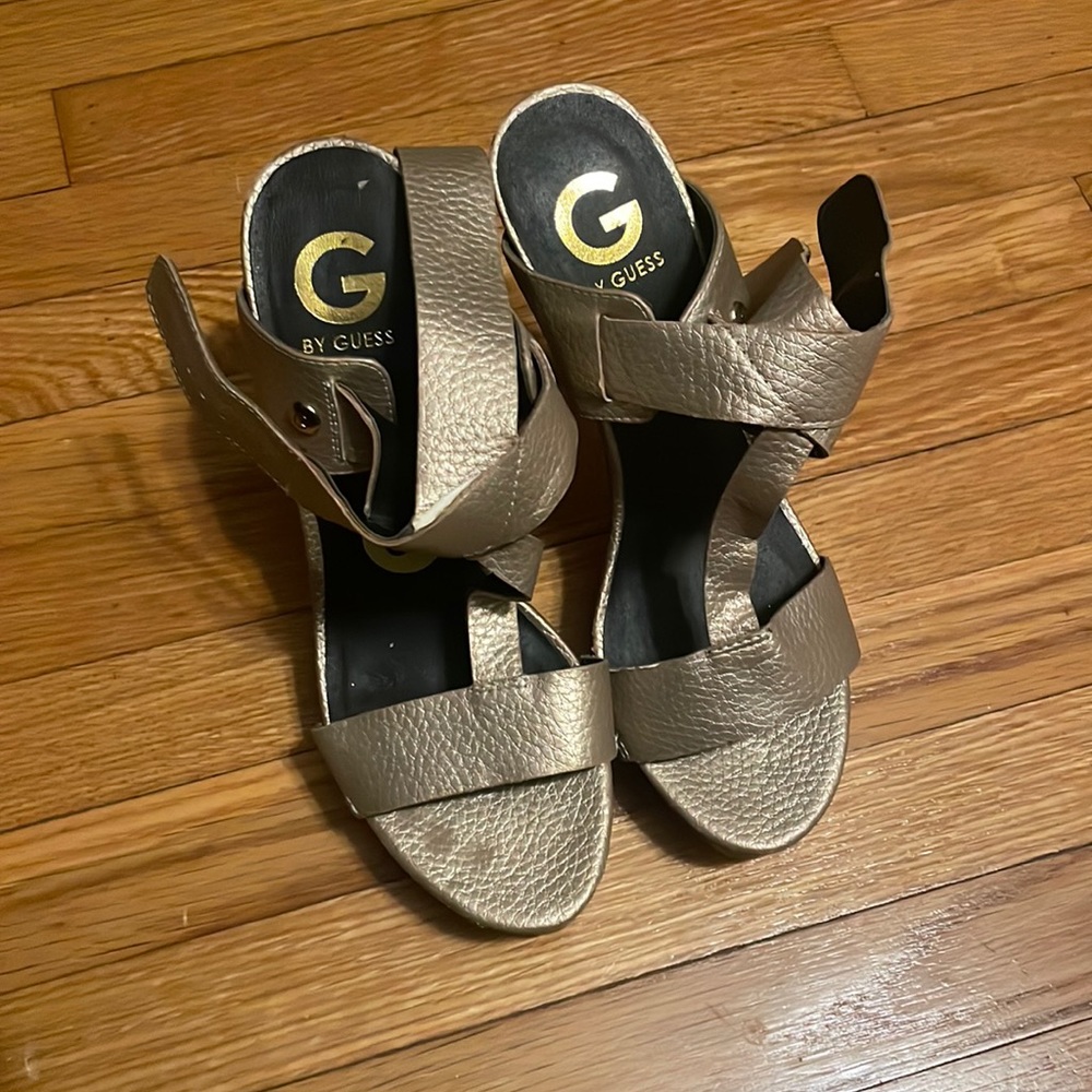 Guess super high heel in Gold with ankle straps.
